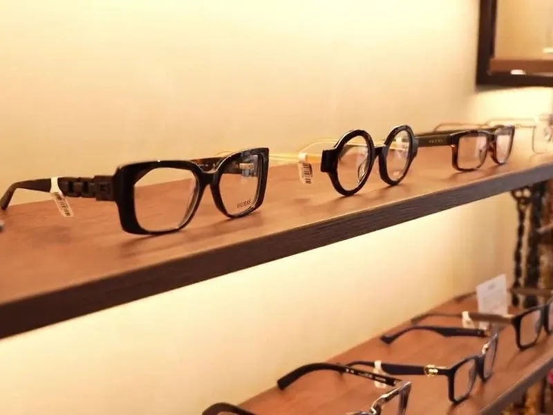A lit display shelf of frames in a STOTTS. practice