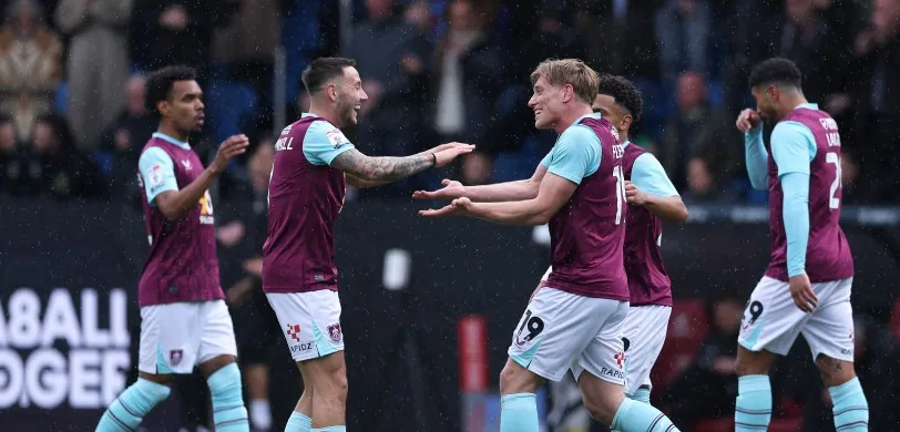 Burnley FC players celebrating during a match