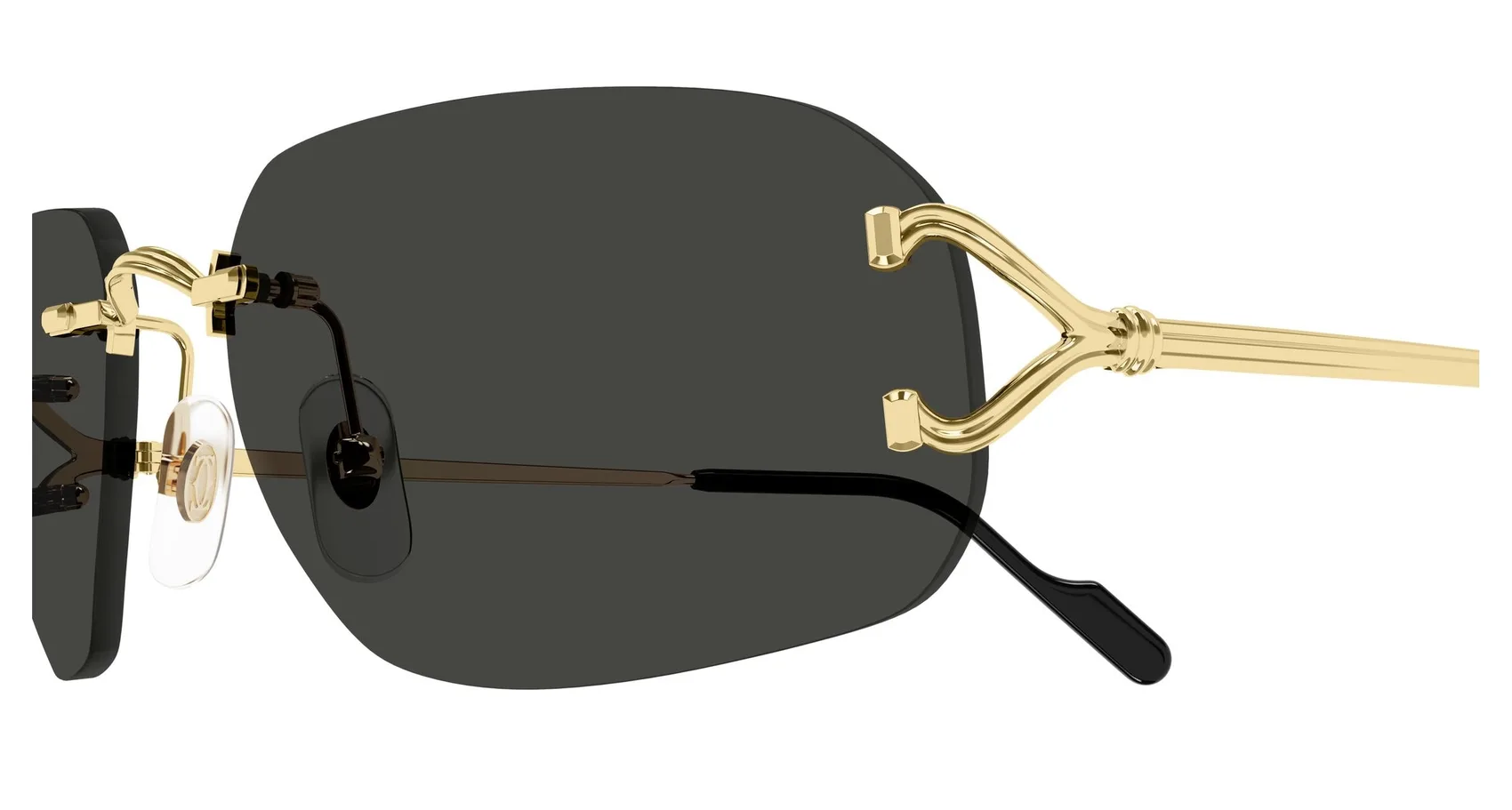 Cartier CT0663S colour 001, detail view. Rounded rectangular rimless sunglasses with gold-coloured temples.