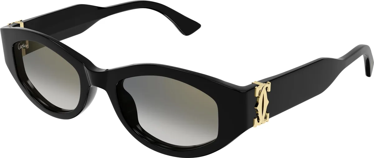 Cartier CT0667S colour 001, three quarter view. Black cat-eye sunglasses with gold-coloured double-C temple details.