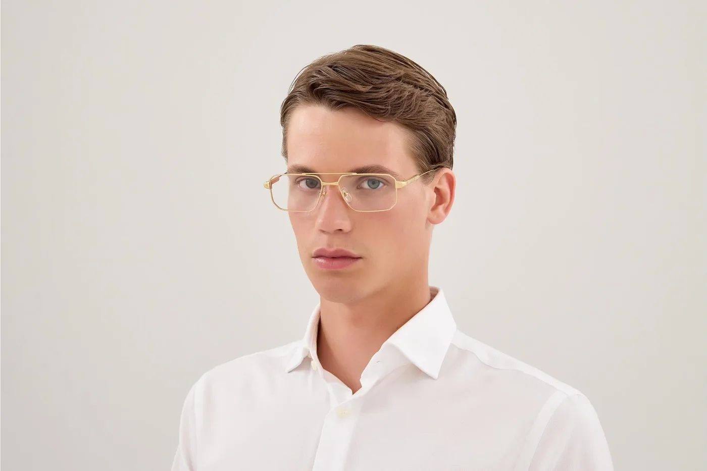 A man wearing Cartier CT0654O colour 001 optical glasses.