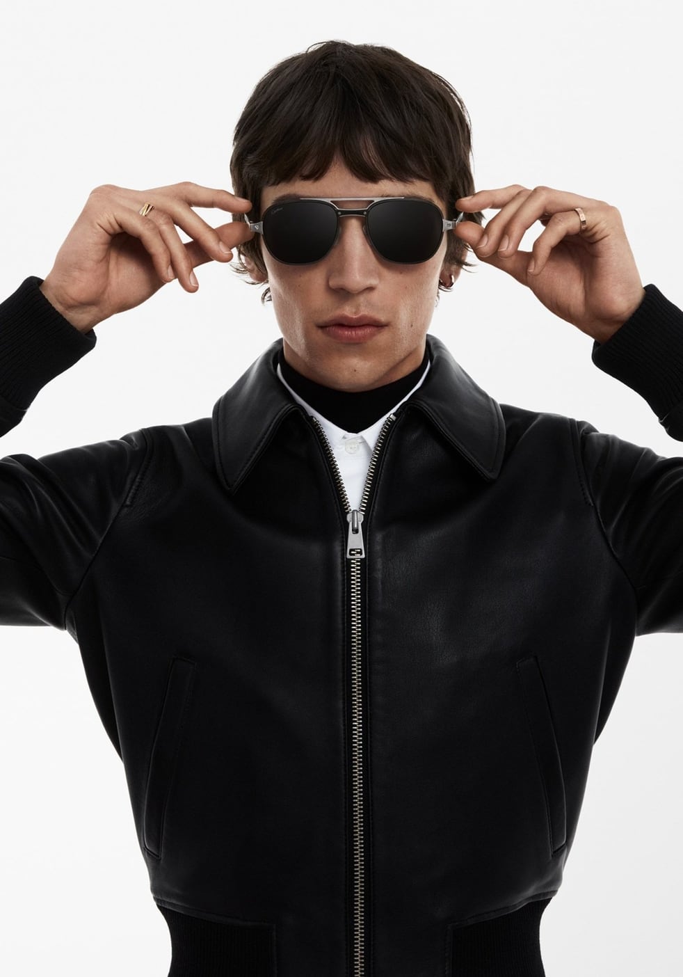 A man wearing Cartier sunglasses with slim metal temples