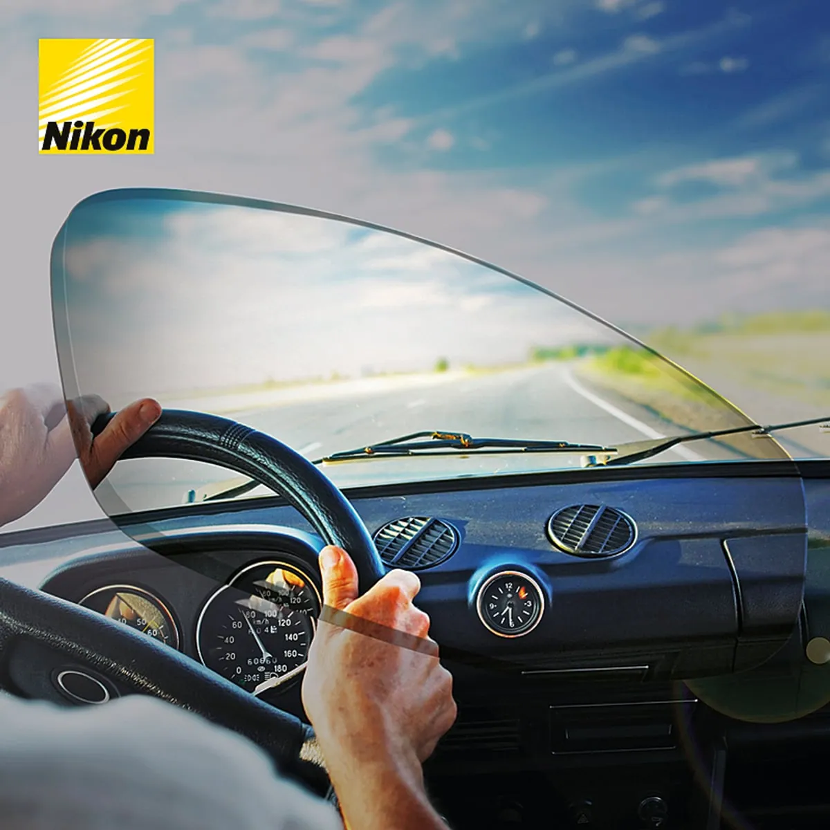 A Nikon Lenswear image showing a clear view of the road ahead through a lens while driving