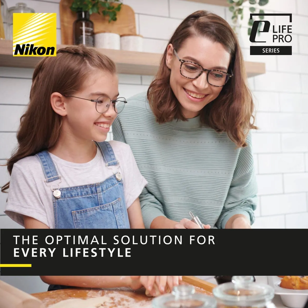 A Nikon Lenswear lifestyle image of a woman and a child wearing glasses while baking together at home