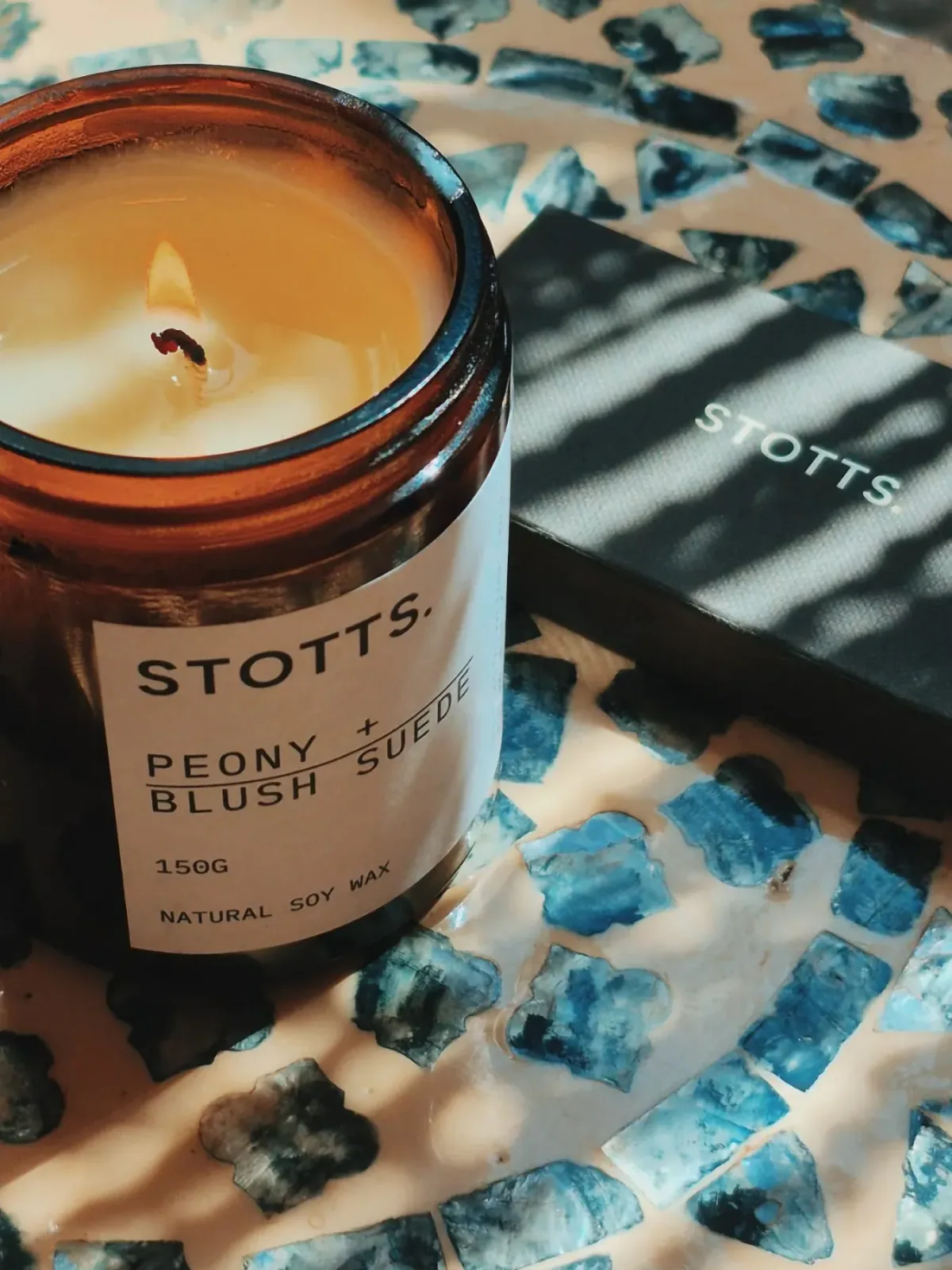 The candle with its cloth box